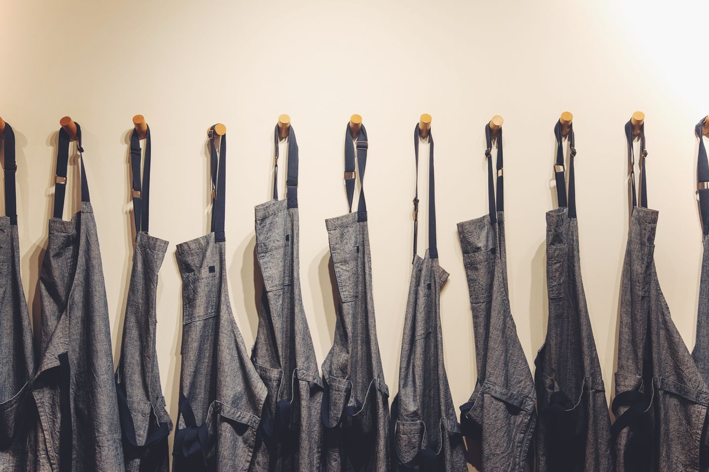 Aprons on wall hooks