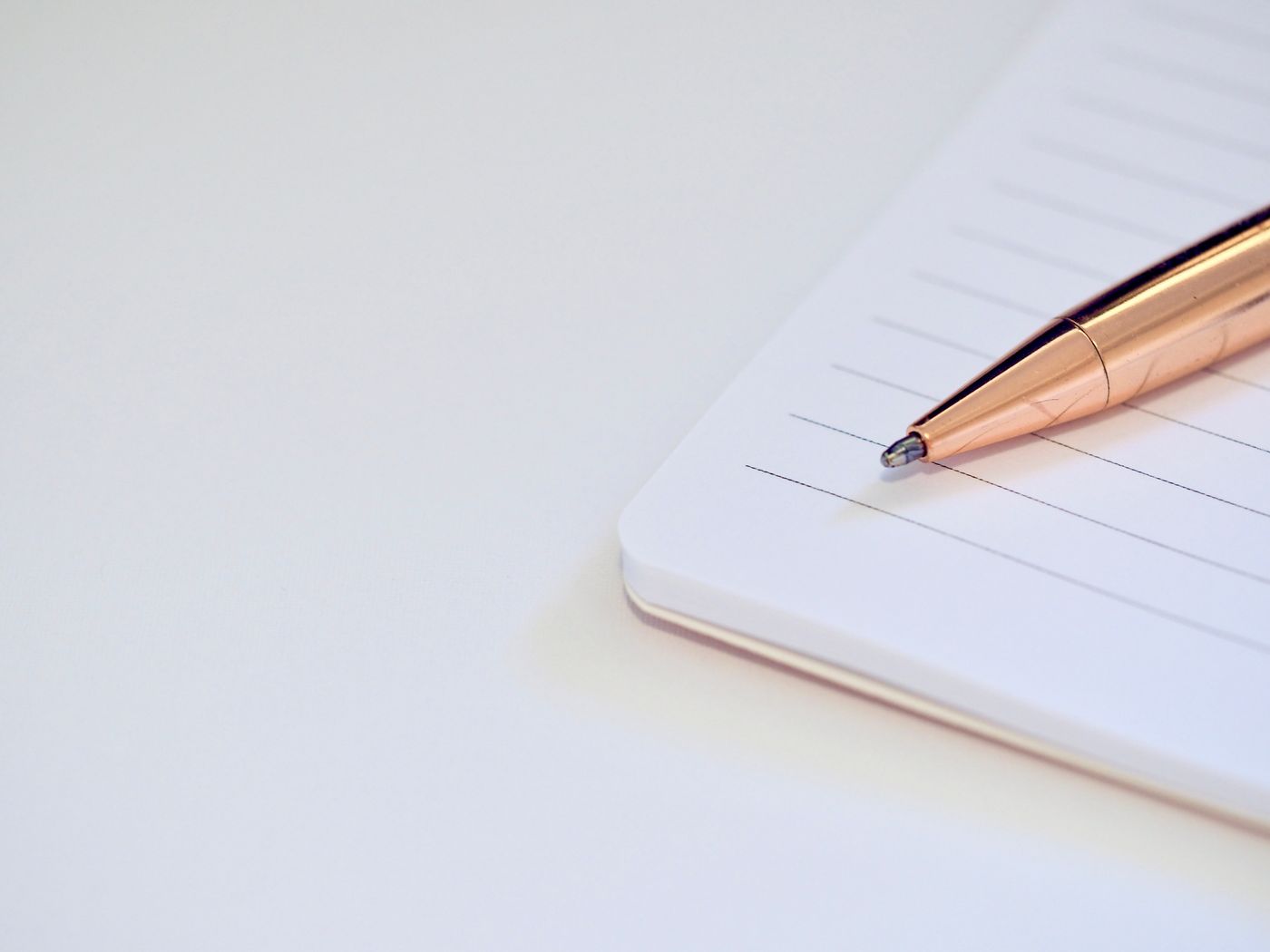 A notebook with a pen