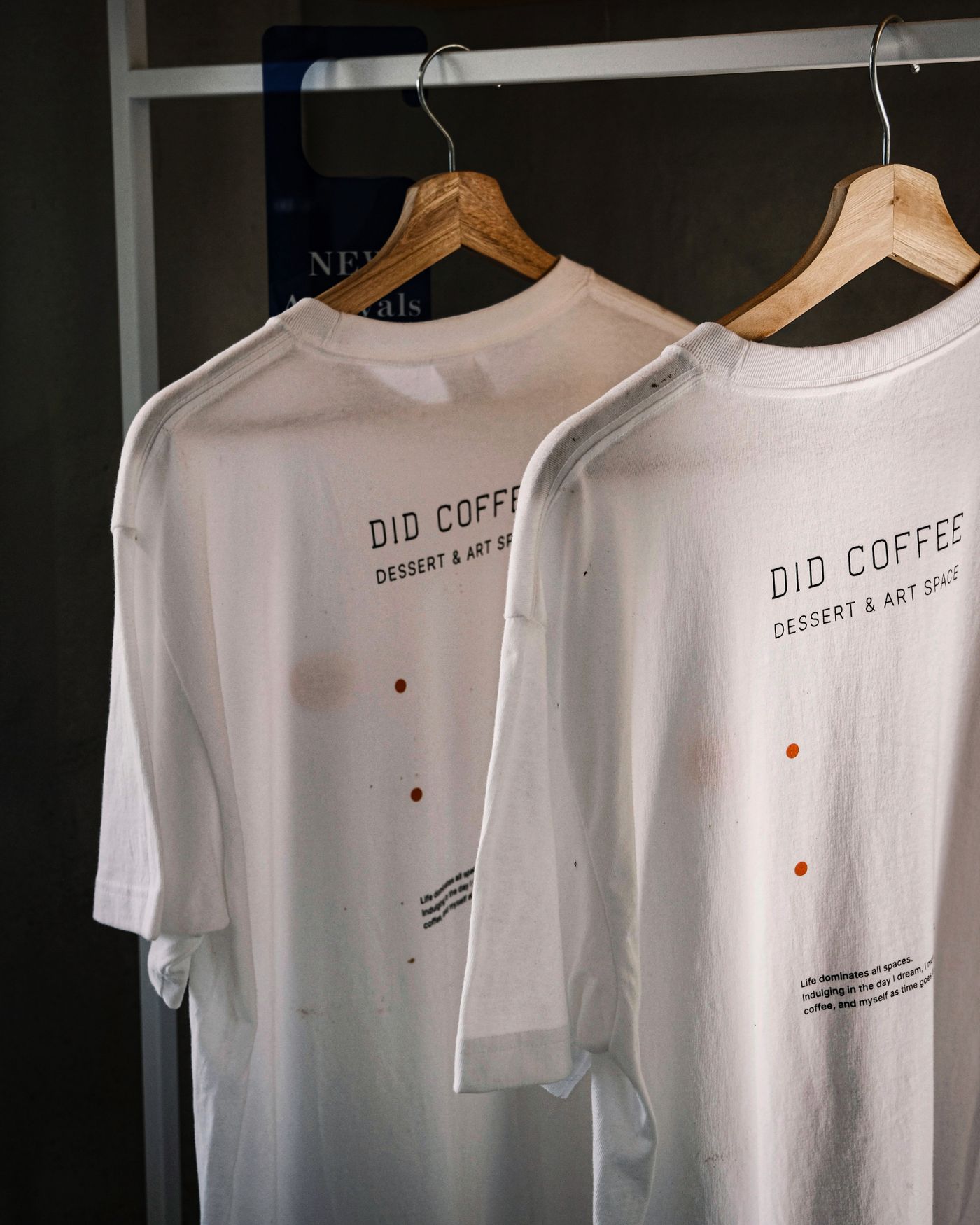 White shirts on wooden hangers