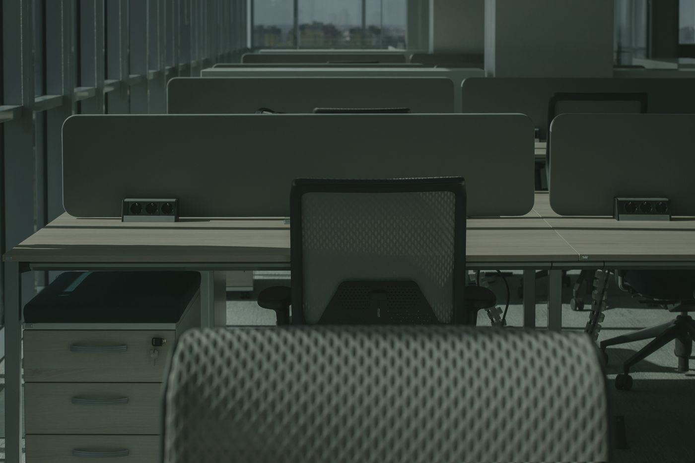 An ergonomic office chair beside a desk