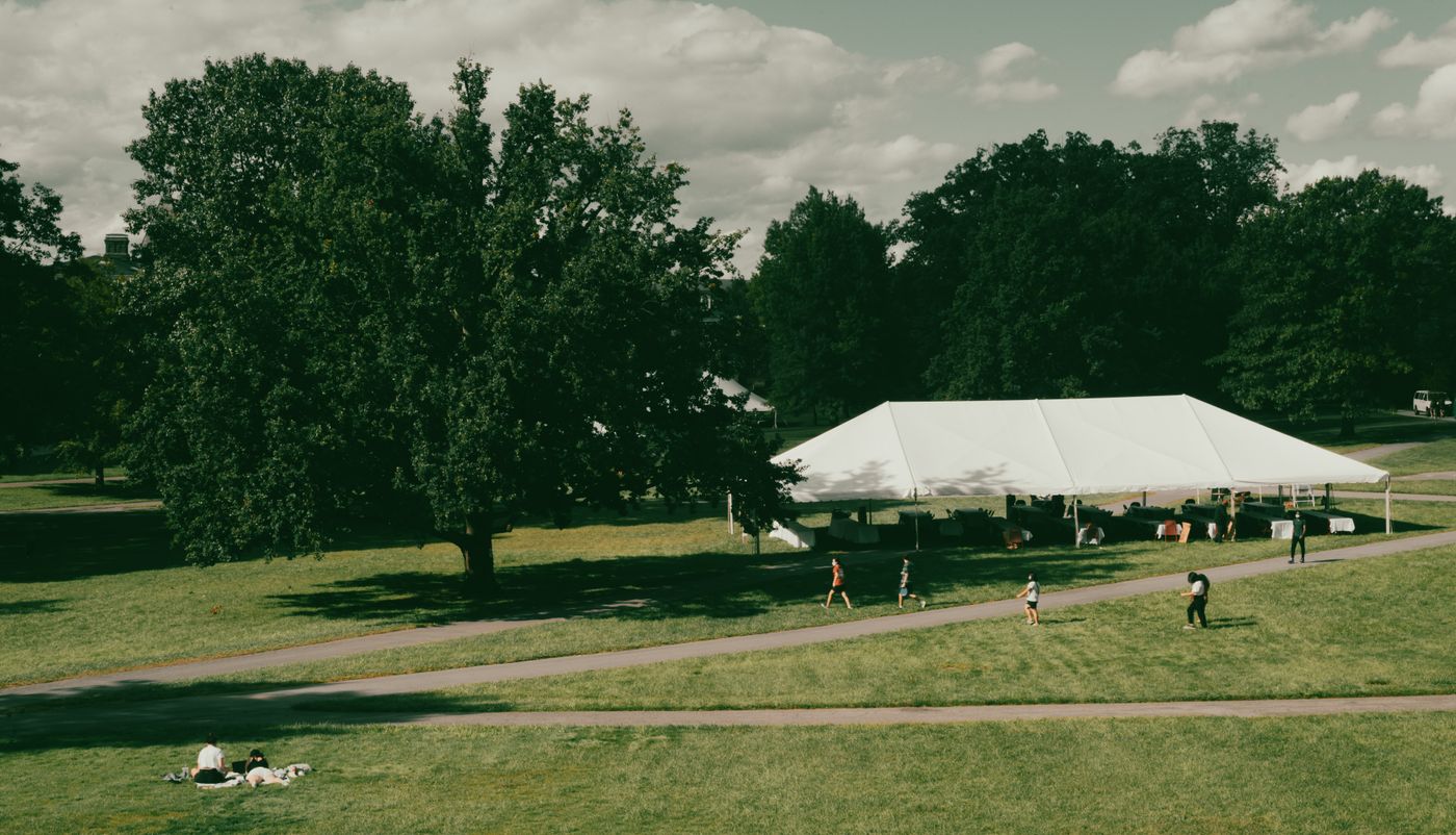 A large white tent on event grounds